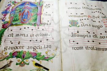 ancient medieval folio with Benedictine chant notes for church service