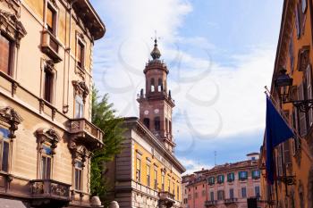 picturesque old houses on medieval street in Parma, Italy in autumn day,