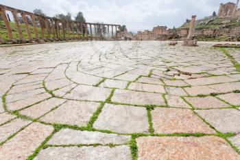 colonnade on the roman oval forum in antique town Jerash in Jordan