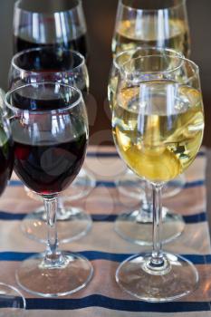 several glasses of red and white wine