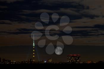 view on Ostankino tower and full moon in Moscow at night