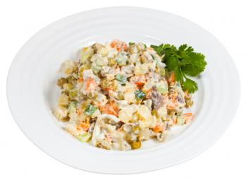 Russian Olivier salad on plate isolated on white background