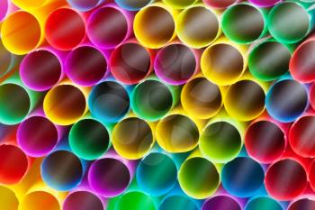 abstract background from multicoloured plastic drinking straws close up