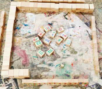playing field of mahjong board game on shabby table