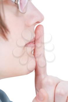forefinger near lips close up - silence hand gesture isolated on white background