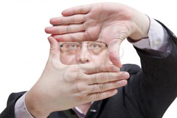 looking through fingers framing - hand gesture isolated on white background