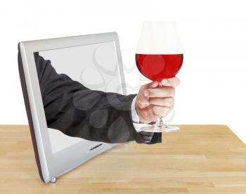 red wine glass in male hand leans out TV screen isolated on white background