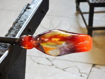 glassblowing of red bottle - glass production