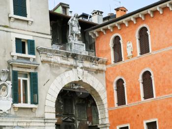 statue of Scipione Maffei and facades of old palace on Piazza dei Signori in Verona city, Italy