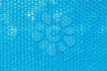 blue background from Bubble wrap on water close up