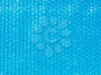background from Bubble wrap film on blue water close up