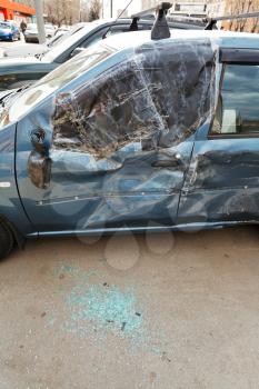 broken window of vehicle during road accident on urban street