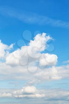 white clouds in blue autumn sky - natural background