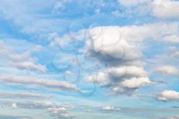 many cumulus clouds in blue autumn sky - natural background
