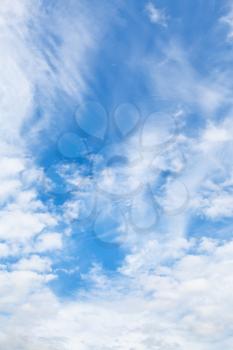 cirrus and cumuli white clouds in blue summer sky