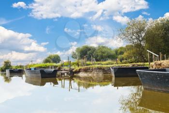 wooden boats near gangways in village de Breca, in Briere Regional Natural Park, France