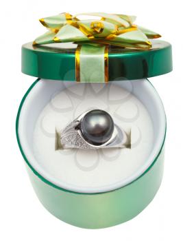 open green box with black pearl in white gold ring isolated on white background