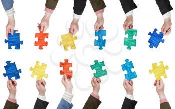 set of male hands with painted puzzle pieces isolated on white background