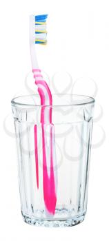 pink toothbrush in glass isolated on white background