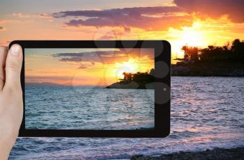 travel concept - tourist taking photo of Gulf of Aegina in Athens on mobile gadget, Greece