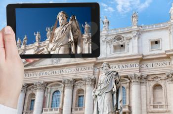 travel concept - tourist taking photo of Statue of Apostle Paul in Vatican on mobile gadget, Rome, Italy