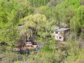 nursery school in green woods in sunny spring day