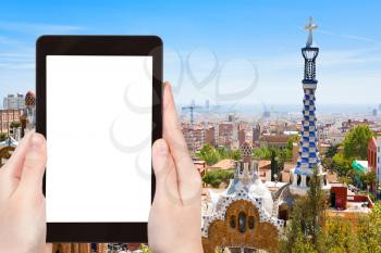 travel concept - tourist photograph Barcelona city, Spain on tablet pc with cut out screen with blank place for advertising logo