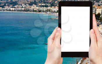travel concept - tourist photograph Azure coast in Nice city, France on tablet pc with cut out screen with blank place for advertising logo