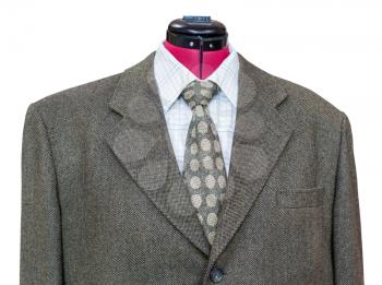 business suit on tailor mannequin - green tweed jacket with shirt and tie close up isolated on white background