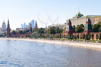 Moscow skyline - view of The Kremlin embankment, Kremlin buildings, walls, towers, Moscow City in summer afternoon