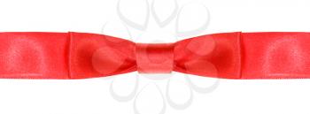 symmetric red bow knot on wide satin tape isolated on white background