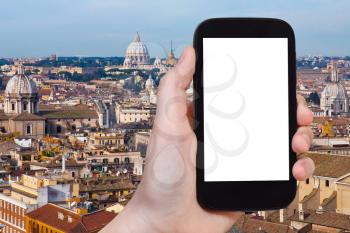 travel concept - hand holds smartphone with cut out screen and Rome cityscape on background