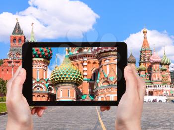 travel concept - tourist photographs picture of Pokrovsky Cathedral on Vasilevsky Descent of Red Square in Moscow Kremlin on tablet pc