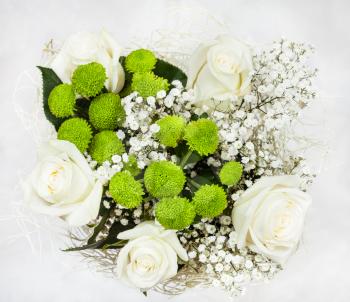 top view of bouquet with white rose flowers on white