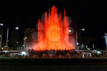 travel to Vienna city - red illuminated Hochstrahlbrunnen fountain on Schwarzenbergplatz square, Vienna,Austria