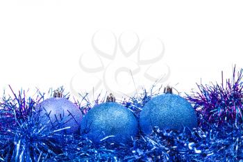 few blue Christmas balls and tinsel isolated on white background