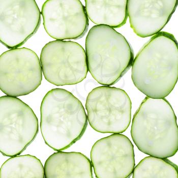 slices of fresh cucumber isolated on white background