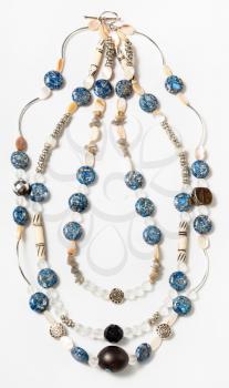 necklace from silver, bone, nacre, artificial stone, glass beads on white background
