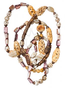 tangled necklace from natural agate, nacre, bone, coconut, ceramic, bronze beads isolated on white background