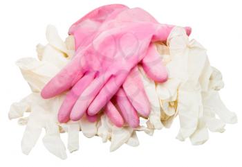 pair of used pink protective gloves on pile of new medical gloves isolated on white background