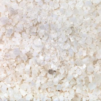 square food background - crystals of common Sea salt close up