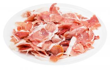 many slices of dry-cured ham on white plate isolated on white background