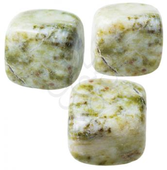 natural mineral gem stone - three Moss agate (mocha stone) gemstones isolated on white background close up