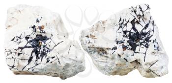 macro shooting of natural mineral stone - two pieces of dolomite rock with Ilmenite crystals isolated on white background