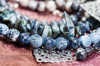 gray blue necklace from natural gemstones close up - Dragon Veins Agate, shell and hematite beads