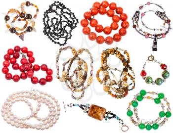 set of matted necklaces from natural gemstones, coral, pearl, bone, beads isolated on white background