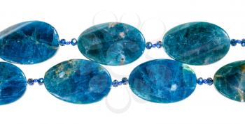 string of beads bead from kyanite gem stone isolated on white background