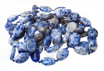 tangled necklace from blue lapis lazuli gemstone beads isolated on white background