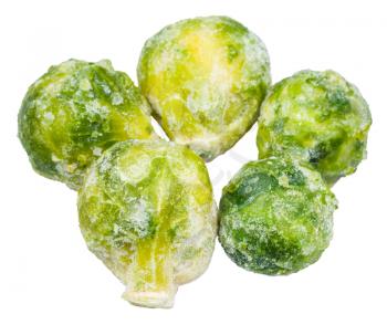 several frozen Brussels sprouts isolated on white background