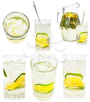 set from glass tumblers with natural lemonade drink from lemon and lime isolated on white background